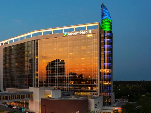AdventHealth Orlando exterior in the evening.
