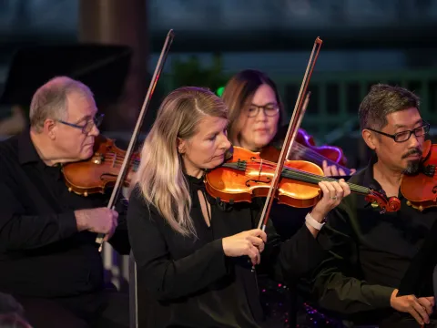 The AdventHealth employee orchestra performs at Disney Springs. 