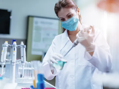 Masked Physician in lab working