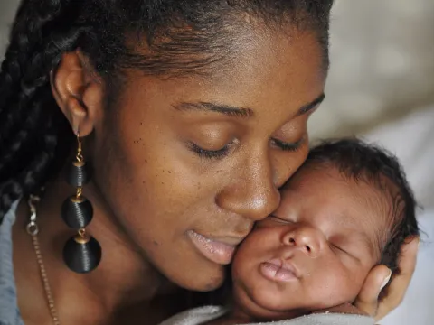 Woman holding her baby