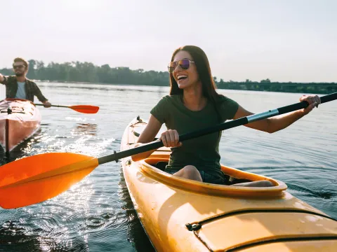 Couple kayaking outdoors together.