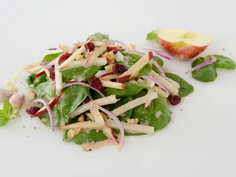 Mound of jicama-apple salad with half apple garnish