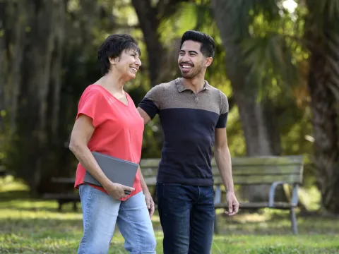 A man and woman walking outdoors in Florida