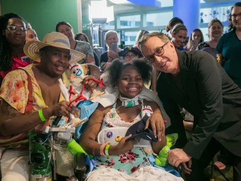Tim Allen visiting a patient at AdventHealth for Children.