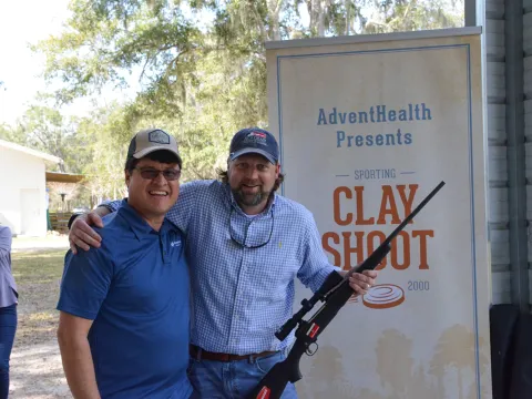 two men holding a gun