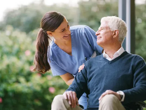 Patient in wheelchair with caregiver