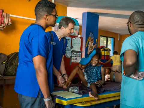 Physicians caring for a small girl