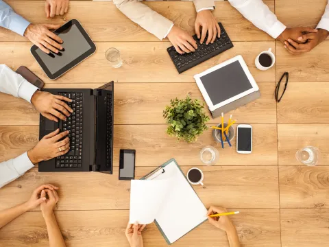 Group collaboration on a table.