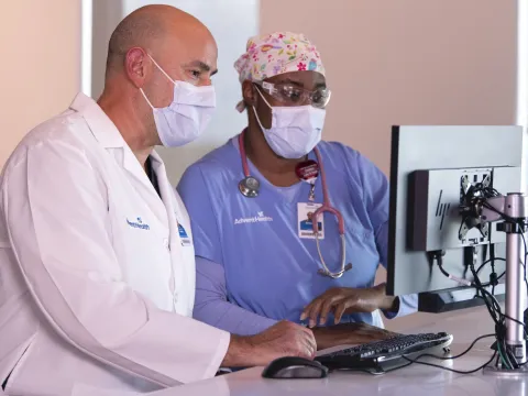AdventHealth clinical staff working at a computer.
