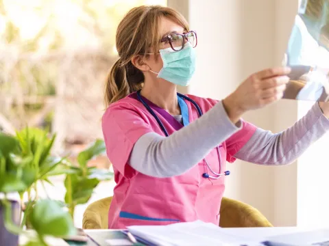 A doctor reviews the results of an imaging test.
