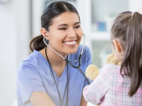 Doctor seeing a pediatric patient.