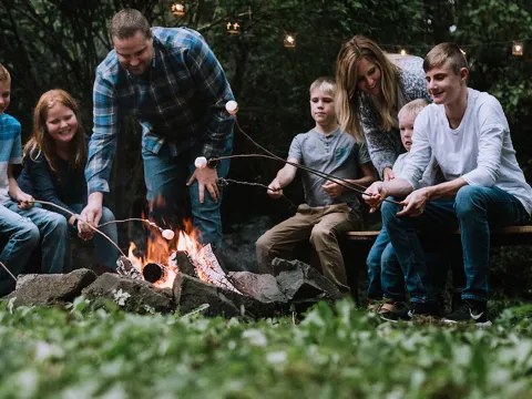 A family by a campfire.