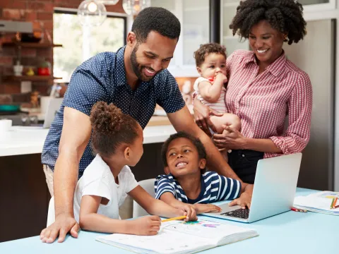 A family does homework together.