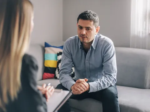 A man taking to a therapist.