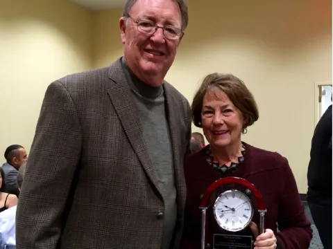 Award winner, Mary Gollier, with her clock trophy