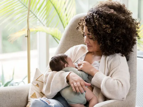 A new mom breastfeeding her infant.