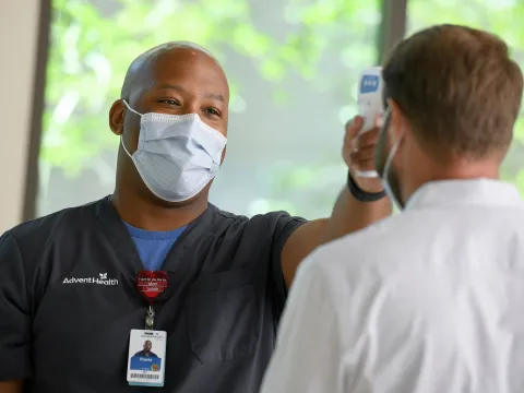 Nurse checking temperature