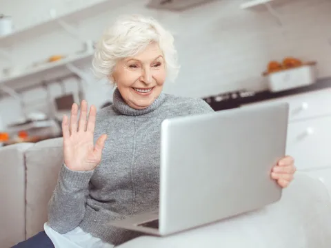 A senior woman video calling.