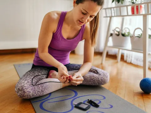 A woman checking her blood sugar.