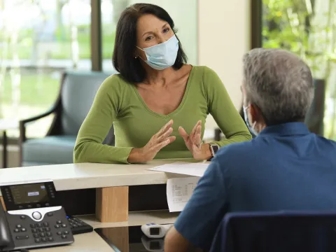 A woman checking in for an appointment.