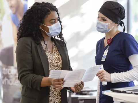 A woman checking in for a visit at AdventHealth.