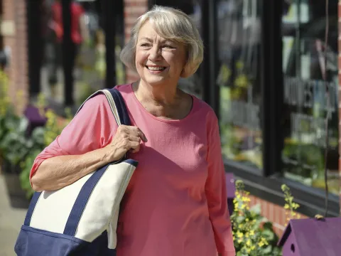 A woman walking outdoors.