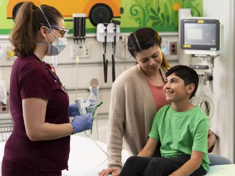 A young boy in a pediatric visit with his mother.