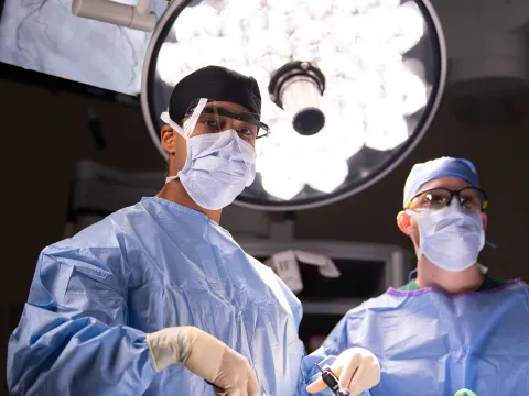 Two surgeons in the middle of a surgery