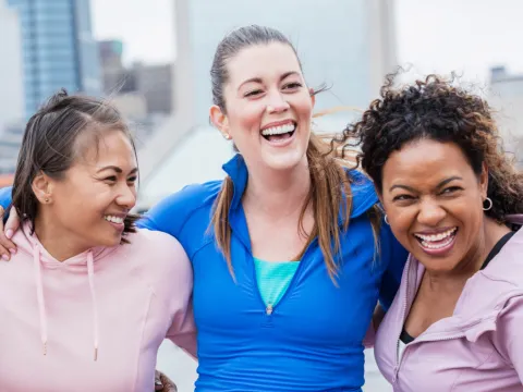 Three smiling female friends