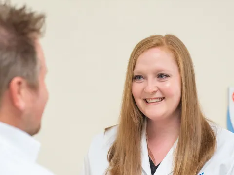 A nurse called, Tiffany Kelley, talking with a patient.