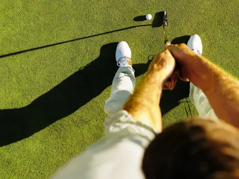 man-playing-golf- ready to put