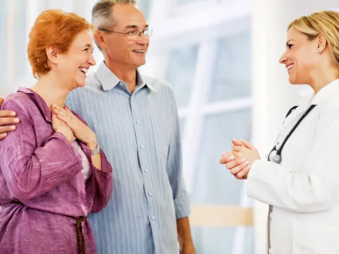 Mature Couple talking to their doctor