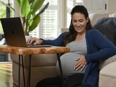 Pregnant woman using a laptop
