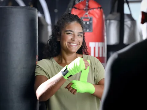 Sharlene wrapping her hands up with tape.
