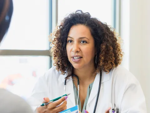 A physician talks to her patient.