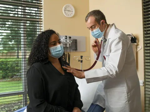 Patient in mask at appointment