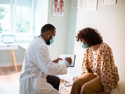 Provider and patient wearing masks in an office