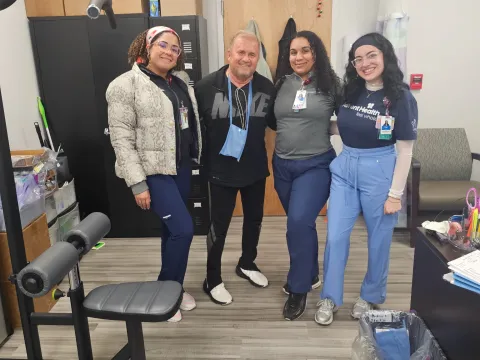 James Harshbarger credits the Cardiac rehab team at AdventHealth Heart of Florida for helping him in his recovery following a third heart attack. Photo of James with three members of cardiac rehab team. (From L-R) Joyness Rodriguez, James Harshbarger, Janel Santana, Paige Gilchrist (photo courtesy: James Harshbarger)