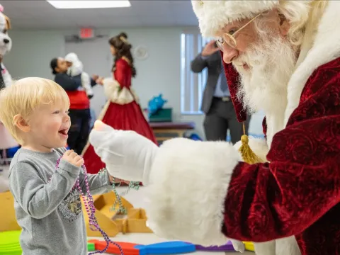 Santa visits AdventHealth Ocala Pediatric Rehab Patient.