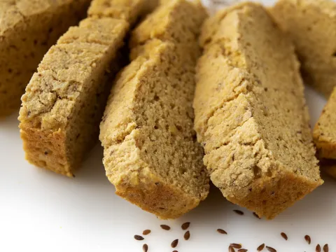 5-6 Slices of cornbread on a white surface