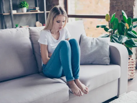 woman experiencing digestive pain
