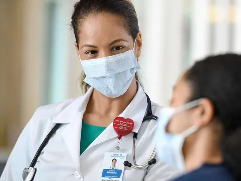 female doctor speaking with patient