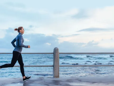 Woman running along the beach