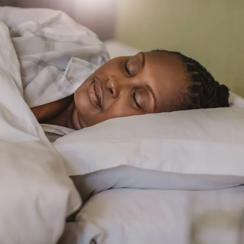 A Woman Sleeps Soundly in Her Bed