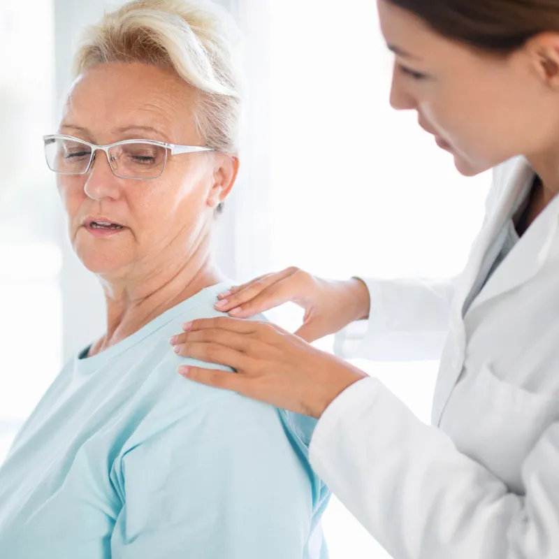 Woman Discussing Her Pain with Doctor