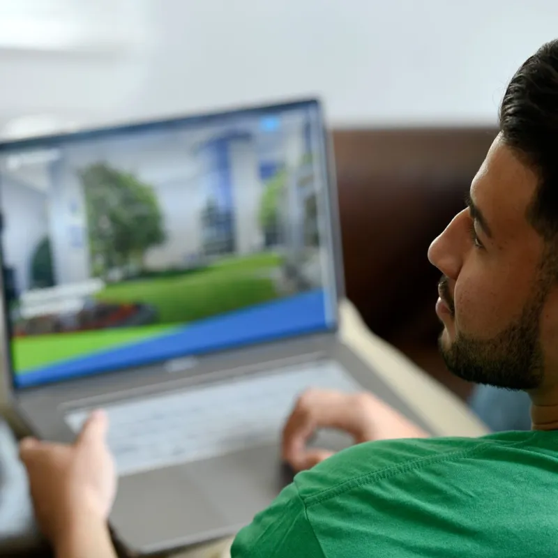 A man using a laptop.