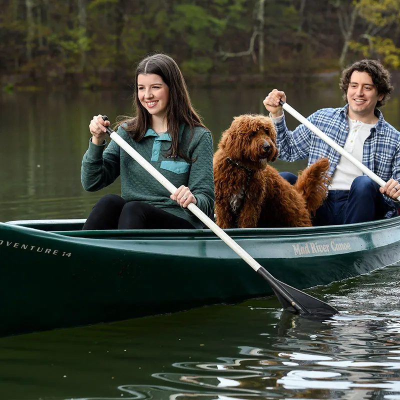 Couple and Dog in a Canoe