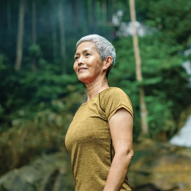 Woman walking in the woods