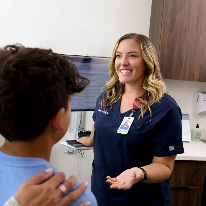 Nurse talking to patient.