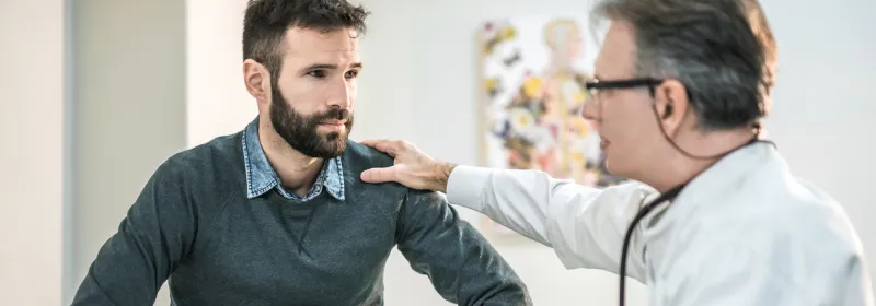 Man at doctor's office for pelvic floor issues